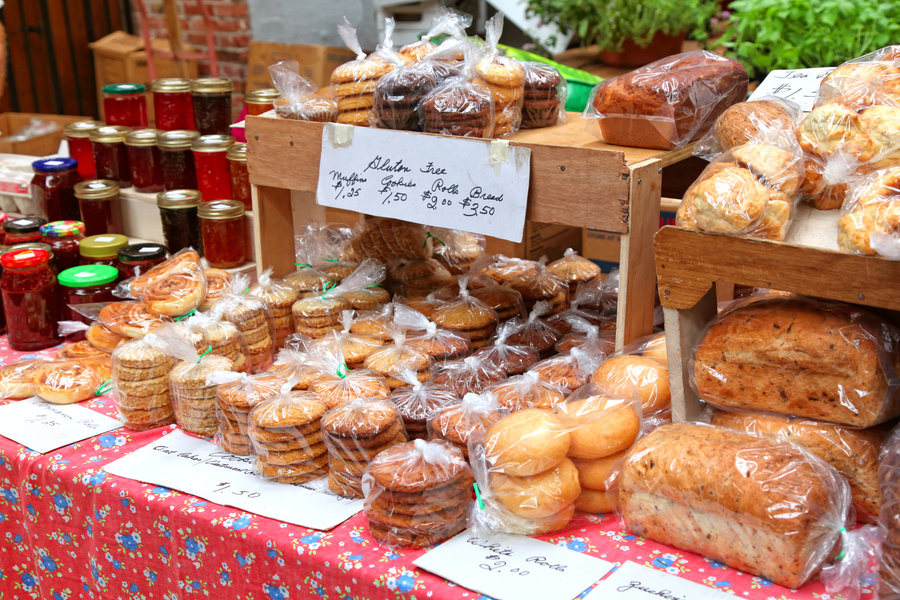 A spread of baked goods and jam at the farmers market